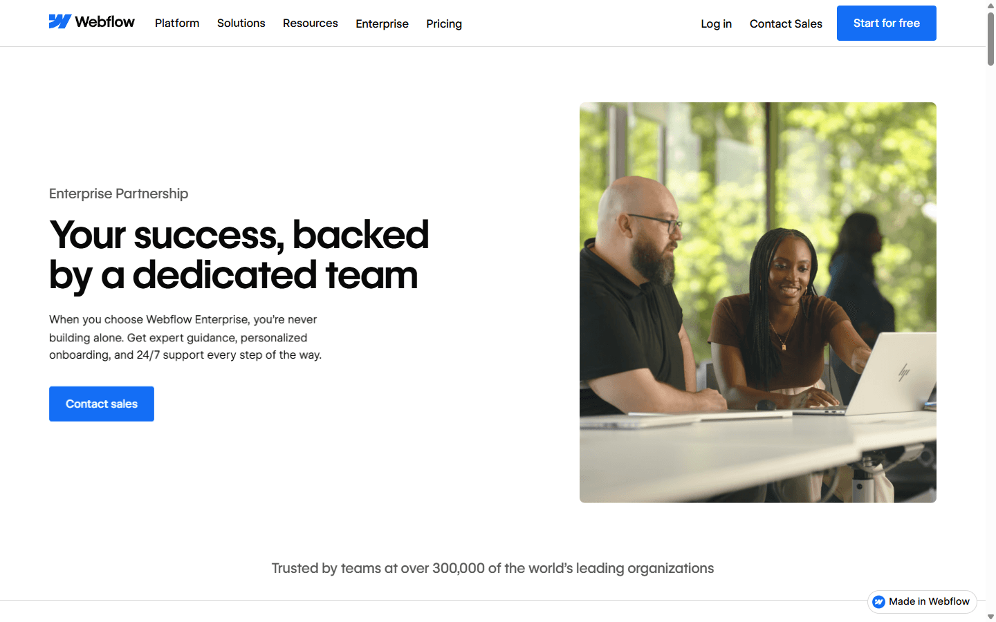 Webflow Enterprise customer success page in English describing a dedicated team, onboarding, and support.